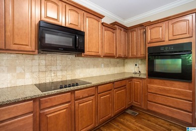 Private lake living at its finest! Tucked away on a wooded lot - photo 13