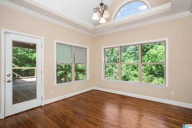 Private lake living at its finest! Tucked away on a wooded lot - photo 14