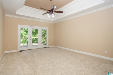 Private lake living at its finest! Tucked away on a wooded lot - photo 17