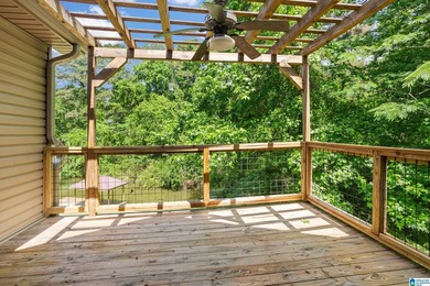 Private lake living at its finest! Tucked away on a wooded lot - photo 23