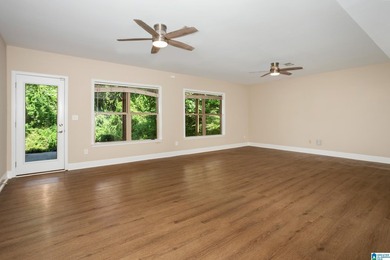 Private lake living at its finest! Tucked away on a wooded lot - photo 31