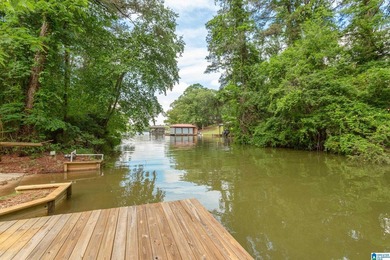 Private lake living at its finest! Tucked away on a wooded lot - photo 44