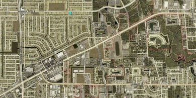 This commercially zoned vacant lot sits in the center of a - photo 3