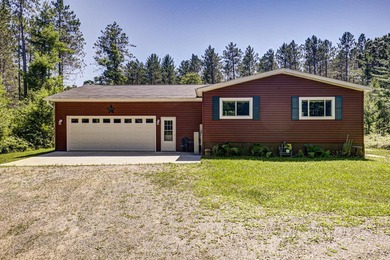 Nestled among the pines just minutes from Lower Post Lake in - photo 1