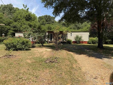 Tucked away on 7 beautiful wooded acres, this private retreat - photo 1