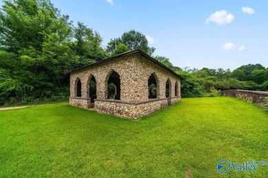 Tucked away on 7 beautiful wooded acres, this private retreat - photo 2