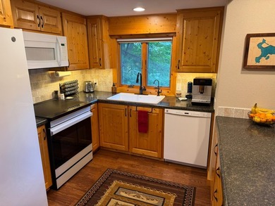 BIRD LAKE CHARMER. Tucked in the woods, this year-round home - photo 10