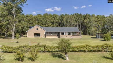 WOW!!! 118 acres surrounds this custom built brick home. Are you