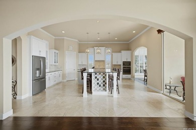 Experience true lakefront living in this stunning custom home - photo 12