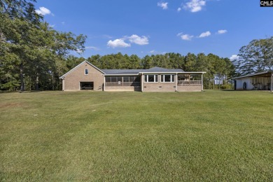 WOW!!! 118 acres surrounds this custom built brick home. Are you