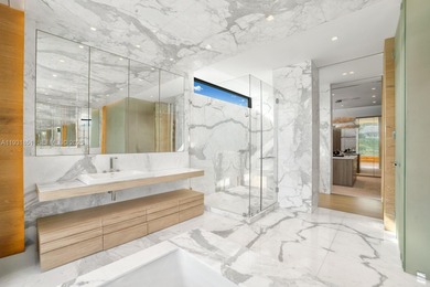 Private island living at its finest. This tropical modern estate