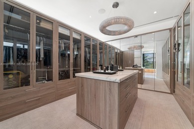 Private island living at its finest. This tropical modern estate