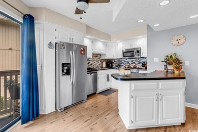 Enjoy coastal living in this beautifully updated second-floor - photo 2