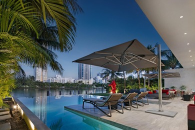 Private island living at its finest. This tropical modern estate