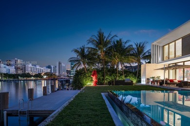 Private island living at its finest. This tropical modern estate