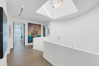 Private island living at its finest. This tropical modern estate