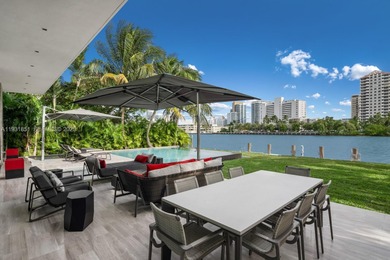 Private island living at its finest. This tropical modern estate