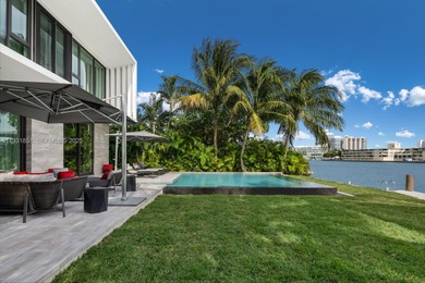 Private island living at its finest. This tropical modern estate