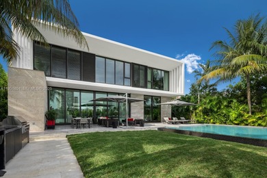 Private island living at its finest. This tropical modern estate