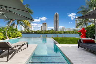 Private island living at its finest. This tropical modern estate