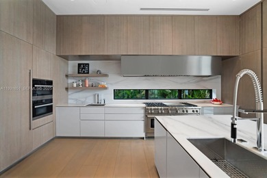 Private island living at its finest. This tropical modern estate