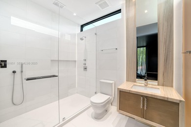 Private island living at its finest. This tropical modern estate