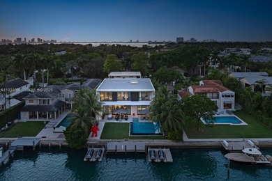 Private island living at its finest. This tropical modern estate
