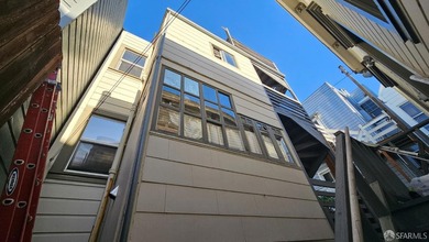 Located between Mission & Valencia Sts. Duplex in the front and - photo 7