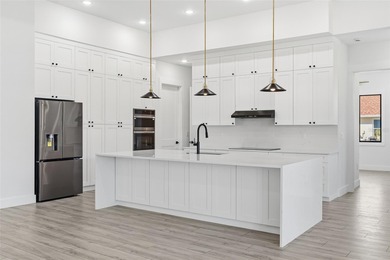 Welcome to this modern, custom-built home perfectly situated on