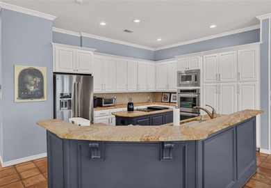 Nestled beneath mature shade trees in the prestigious gated - photo 15