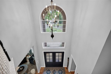 Nestled beneath mature shade trees in the prestigious gated - photo 25