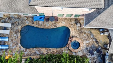 Nestled beneath mature shade trees in the prestigious gated - photo 34