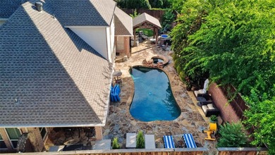 Nestled beneath mature shade trees in the prestigious gated - photo 35