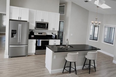 Beautifully renovated and move-in ready, this spacious 3-bedroom - photo 5