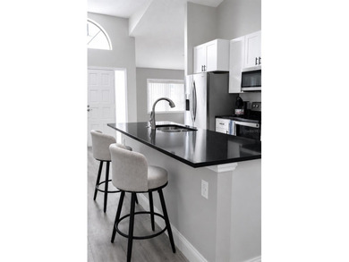 Beautifully renovated and move-in ready, this spacious 3-bedroom - photo 7