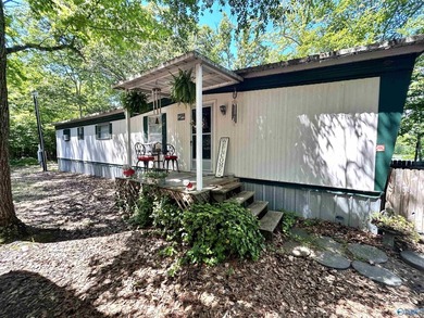 Enjoy lakeside living in this charming 3-bed / 1.5-bath mfg home - photo 1