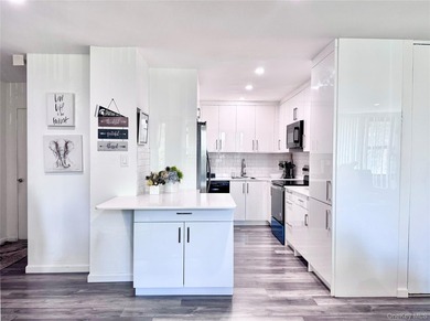 Move right in! This bright, spacious, renovated 5th-floor corner - photo 2