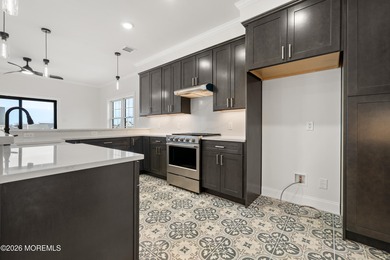 The epitome of a modern coastal New Construction waterfront home