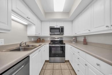 This beautifully maintained four-bedroom, end unit oceanfront