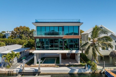 A striking new construction waterfront residence, offering a