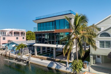 A striking new construction waterfront residence, offering a