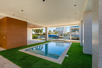 A striking new construction waterfront residence, offering a