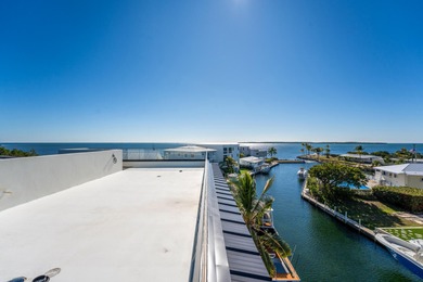 A striking new construction waterfront residence, offering a