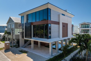 A striking new construction waterfront residence, offering a