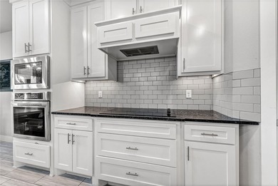 Tucked into the wooded hills of Bella Vista, this home delivers - photo 20
