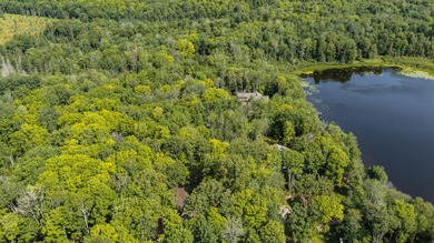 Exceptional opportunity to own 4.4 wooded acres with 326 feet of - photo 9