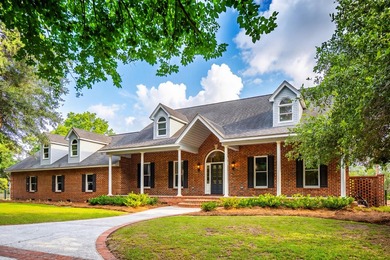 Set on 2.3 private acres overlooking the marsh, 5038 Stono - photo 1