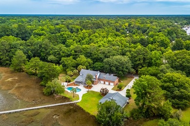 Set on 2.3 private acres overlooking the marsh, 5038 Stono - photo 4