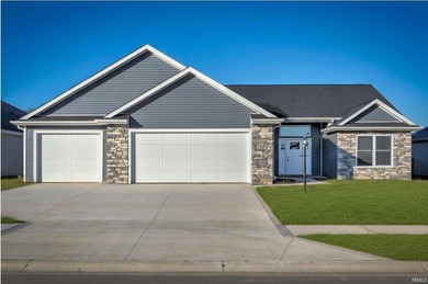 This new construction, ranch home, sits on a pond lot in the new - photo 1