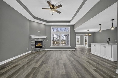 This new construction, ranch home, sits on a pond lot in the new - photo 2